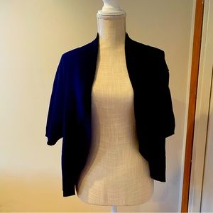 Waist length buttonless cardigan